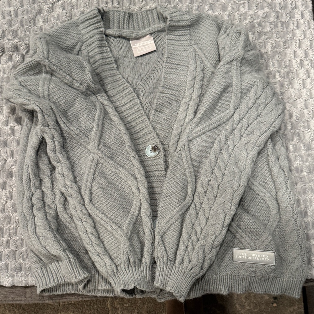 Taylor Swift The Tortured Poets Department gray cardigan.